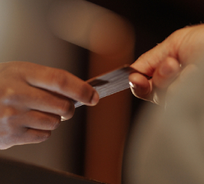 hand handling a credit card